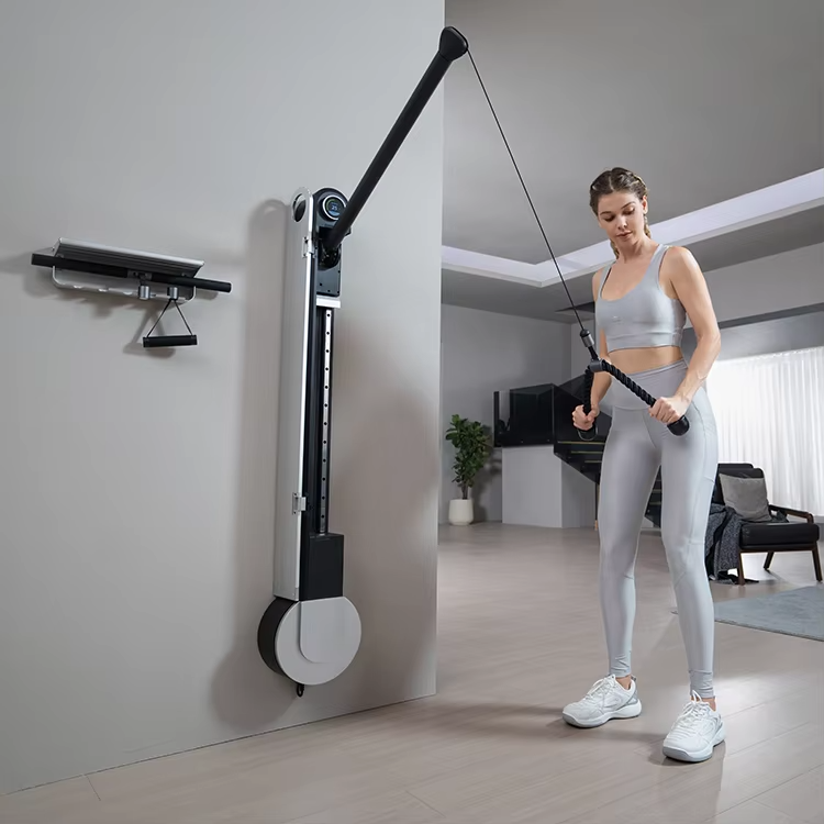 Woman exercising using a wall-mounted cable machine in a home setting.